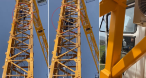 İtfaiye ekipleri, yaklaşık 50 metre tırmandığı vinçte mahsur kalan adamı