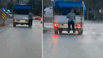 Bursa'da seyir halindeki kamyonetin arkasına tutunarak seyahat eden patenli genç,