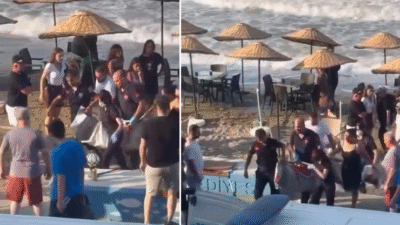 Bursa'nın Mudanya ilçesinde fırtınalı havada serinlemek için denize giren 10