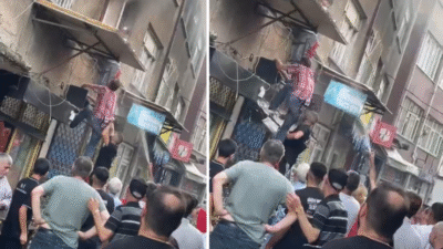 Bursa'da bir evde çıkan yangında içeride mahsur kalan kadın, vatandaşlar